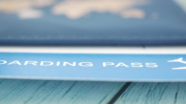 Travel plans take shape with a boarding pass on a blue table