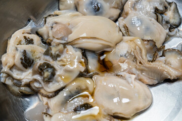 sesame oil on the raw oysters