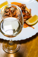 white wine at the dish of spicy raw oysters