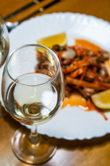 white wine at the dish of spicy raw oysters