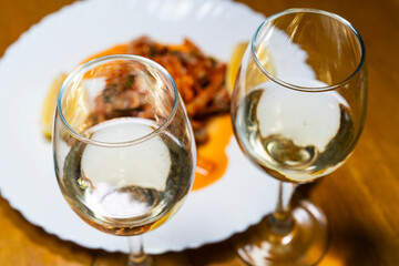 white wine at the dish of spicy raw oysters