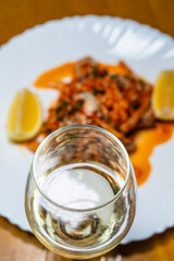 white wine at the dish of spicy raw oysters