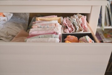 clothes and underwear for babies in the drawer. pure baby cotton clothes. Clothing storage