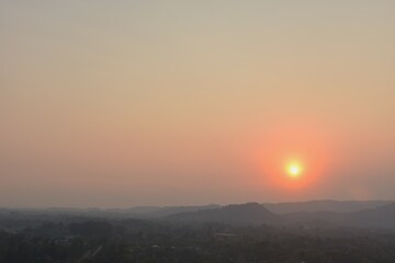 sunset into mountain at Khun Dan Prakarn Chon huge concrete dam in evening on Thailand 