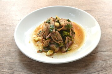 slice boiled pork with chop shallot and chili Thai salad taste spicy and sour on plate