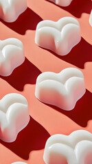 White heart-shaped wax melts arranged on coral background.  Perfect for product listing, blog, or website