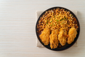 Korean instant noodles with fried chicken or Fried chicken ramyeon