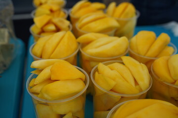 Yellow fresh sweet slice mango clear cup