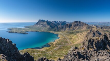 Panoramic view of a road cutting through the East Fjords of Iceland, blending mountains, ocean, and endless beauty.