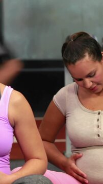 Pregnant women in fitness studio