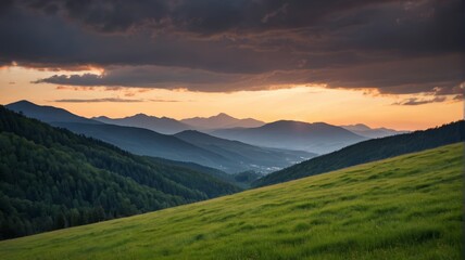 Obraz premium mountains in the distance with a green field and a few trees