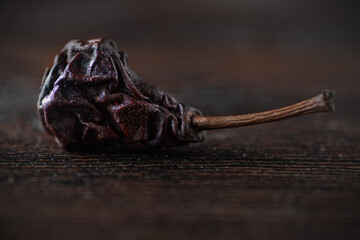 Close up picture of organic dried pear over dark background