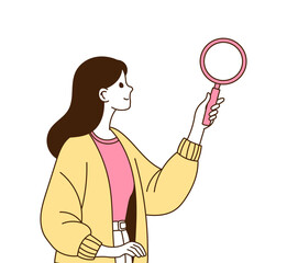 A woman looking at it with a magnifying glass.