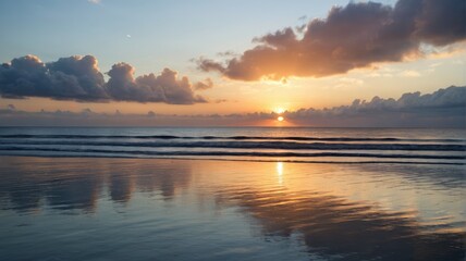 sunset on the beach with a person walking on the sand
