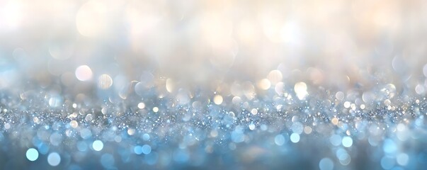 Obraz premium A mesmerizing background of shimmering blue and white bokeh lights creates a dreamy atmosphere perfect for invitations, websites, or social media content