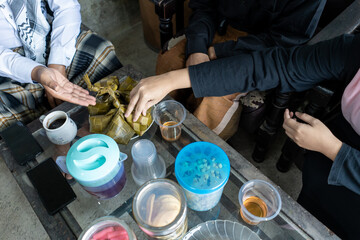top view, traditional Indonesian dish “Ketupat” served on the table during Eid celebration