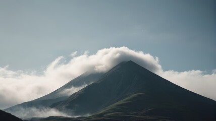 Fototapeta premium there is a large mountain with a cloud covering it