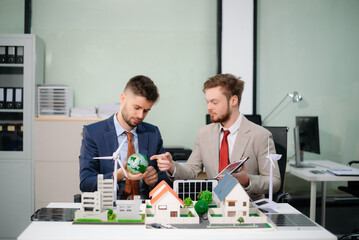  Professionals for a greener future. Showcasing renewable energy solutions with solar panels, wind...