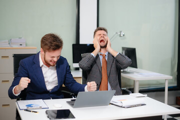 A stressed business team in shock after financial failure. Upset colleagues brainstorm solutions, reacting to bad news