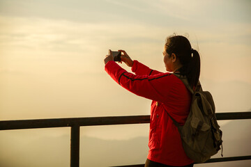 Woman traveler with backpack hiking outdoor travel lifestyle and adventure concept. cap backpack...