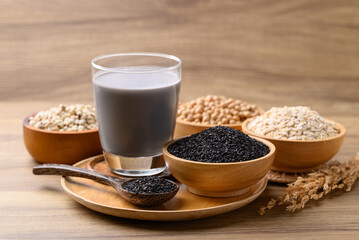 Alternative milk made from plant on wooden background, non dairy, Vegan food