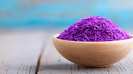 Fototapeta premium Purple flower petals in wooden bowl on rustic table