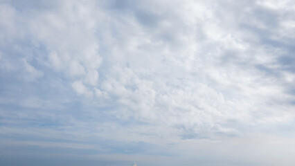 Sky Contrast: Bright and Overcast Clouds in an Aerial View

