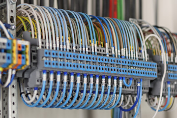 Electrical screw terminals for connecting wires in an electrical switchboard. Soft focus. Close-up.