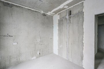 rough repairs for self-finishing. interior decoration, bare walls of the room, stage of...