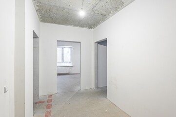 rough repairs for self-finishing. interior decoration, bare walls of the room, stage of construction. interior apartment room