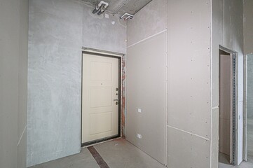rough repairs for self-finishing. interior decoration, bare walls of the room, stage of construction. interior apartment room