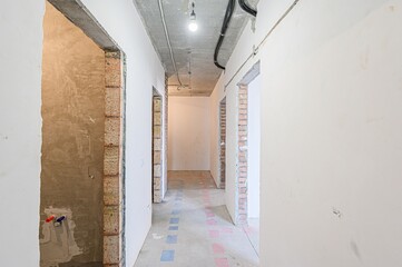 rough repairs for self-finishing. interior decoration, bare walls of the room, stage of...