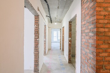 rough repairs for self-finishing. interior decoration, bare walls of the room, stage of...