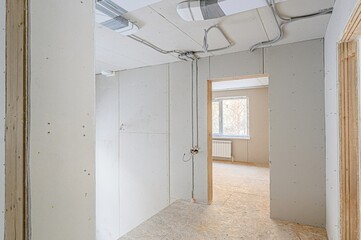 rough repairs for self-finishing. interior decoration, bare walls of the room, stage of construction. interior apartment room