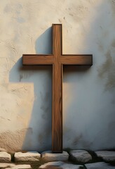 A weathered wooden cross stands against a textured wall, bathed in sunlight. The image evokes feelings of faith, hope, and spiritual reflection.