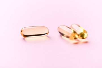 Fish oil capsules with omega 3 on bright background. Concept for a healthy dietary supplementation....