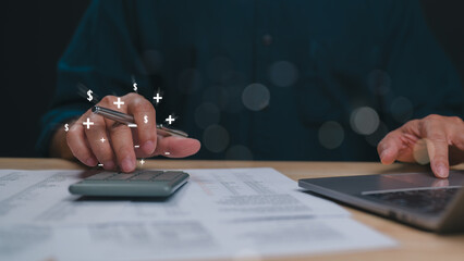 Financial Management in Action, Focused individual calculates finances with calculator, pen in...