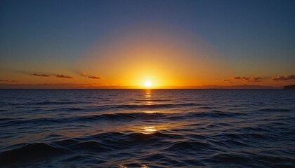 Obraz premium Glowing horizon over calm ocean at sunrise, blending golden light with blue sky