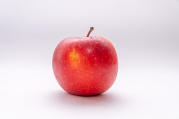 One red apple on a white background
