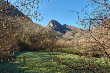 Majestic mountain peaks seen from a scenic trail in Redes natural park, Asturias