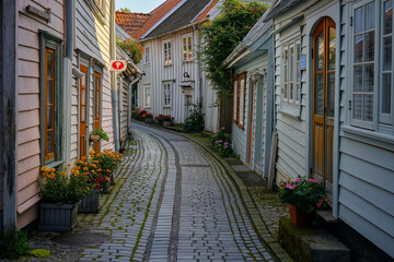 A charming, narrow street in the old center of Stavanger, Norway, lined with traditional wooden houses painted in soft, pastel colors