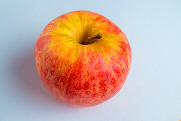 One ripe organic apple on a white background