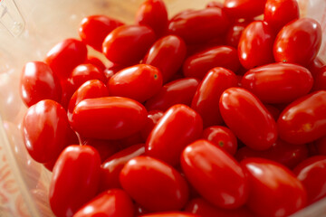 A closeup view of a package of red cherry tomatoes.
