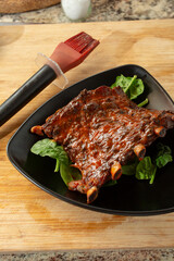 A view of a plate of BBQ pork ribs.