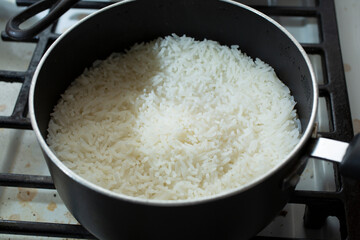 A view of cooked white rice in a non-stick pot.