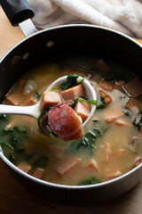 A view of a pot of ham and potato soup.