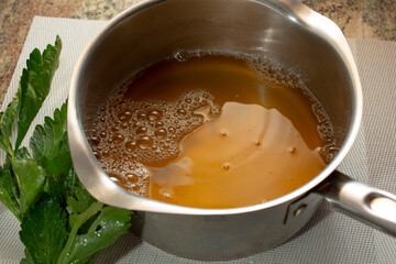 A view of a stockpot of bone broth.