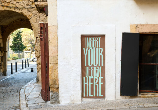 Vertical Poster Mockup on Urban Building Facade in Tarragona