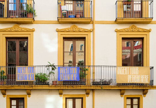 Urban Building With Three Blank Banners hang on Balconies in Tarragona