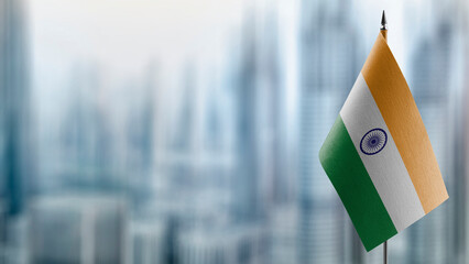 Small flags of the India on an abstract blurry background